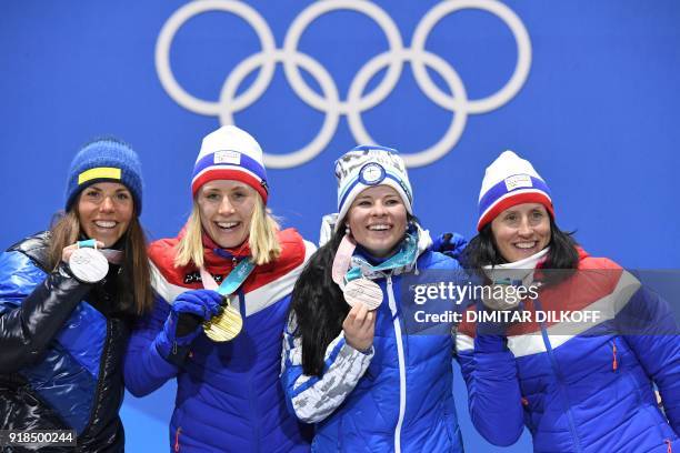 Sweden's silver medallist Charlotte Kalla, Norway's gold medallist Ragnhild Haga and bronze medallists Finland's Krista Parmakoski and Norway's Marit...