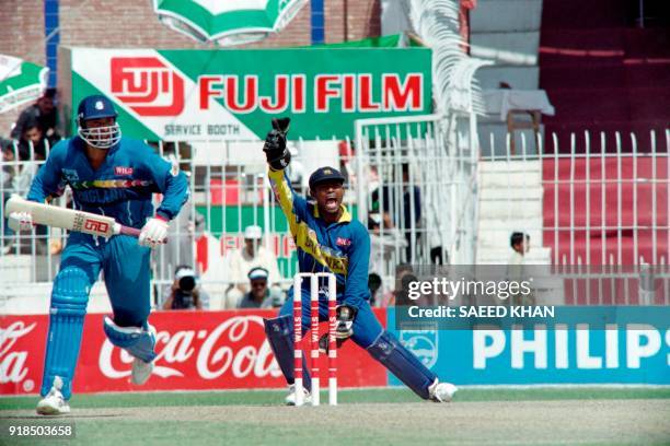 Sri Lankan wicket keeper Kaluwitharana appeals confidently for LBW against England's highest scorer Philip DEfreitas during the first quarter-final...