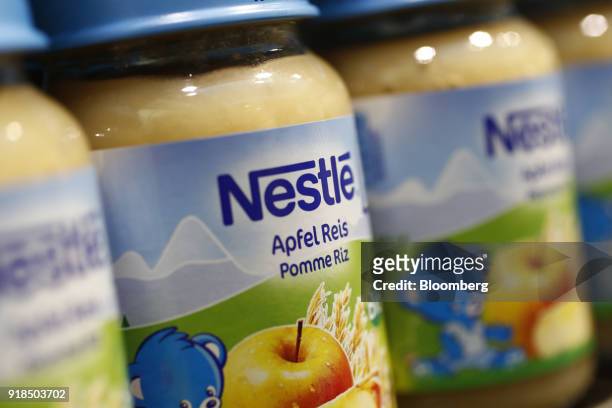 Jars of Nestle apple rice baby food stand on display in a shop at the Nestle SA headquarters in Vevey, Switzerland, on Thursday, Feb. 15, 2018. Since...