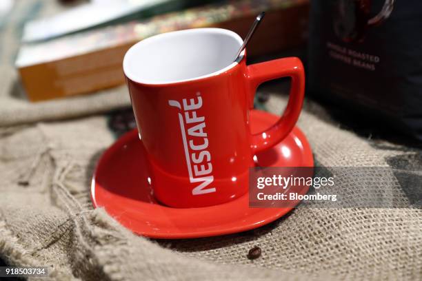 Red Nescafe branded coffee cup stands on display at the Nestle SA headquarters in Vevey, Switzerland, on Thursday, Feb. 15, 2018. Since taking over...