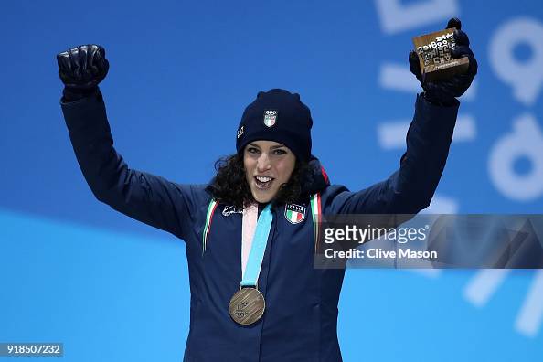 Bronze medalist Federica Brignone of Italy celebrates during the ...