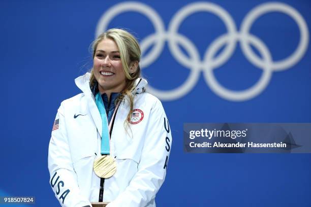 Gold medalist Mikaela Shiffrin of the United States celebrates during the medal ceremony for Alpine Skiing - Ladies' Giant Slalom on day six of the...