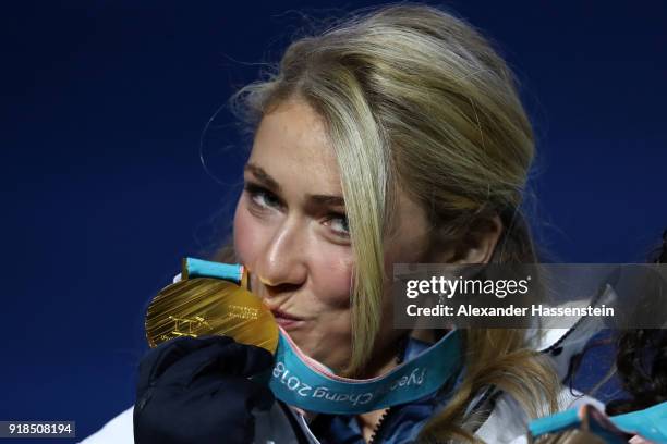 Gold medalist Mikaela Shiffrin of the United States kisses her medal during the medal ceremony for Alpine Skiing - Ladies' Giant Slalom on day six of...