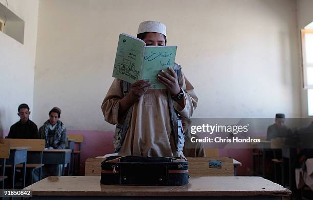 Student reads an essay he wrote aloud at Balish High School October 13, 2009 in Orgune, Afghanistan. Balish High School is all male; boys' and girls'...