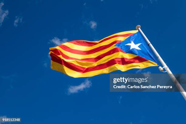 estelada flag of catalonia in costa brava spain - catalani stock pictures, royalty-free photos & images