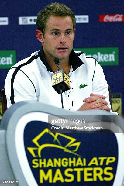 Andy Roddick of the United States fields questions from the media at a press conference after retiring from his match against Stanilas Wawrinka of...