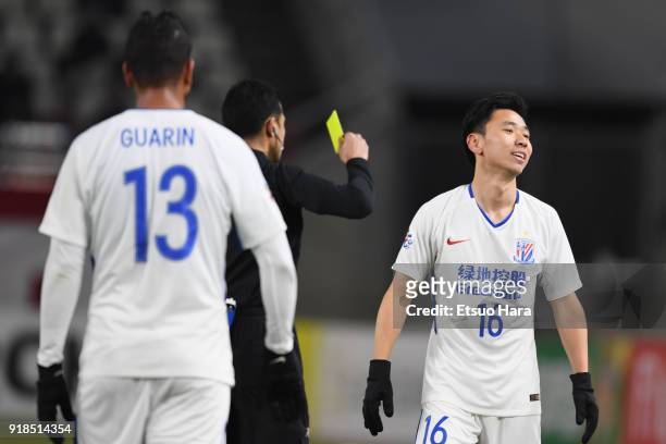 Li Yunqiu of Shanghai Shenhua receives an yellow card during the AFC Champions League Group H match between Kashima Antlers and Shanghai Shenhua at...
