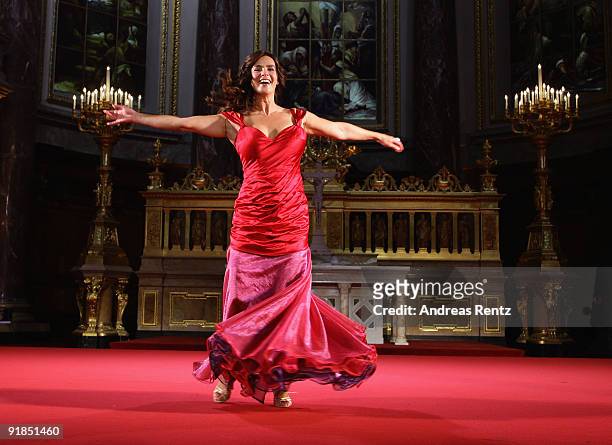 Katarina Witt performs on stage during the 'Jedermann' dress rehearsal at the Berlin Cathedral Church on October 13, 2009 in Berlin, Germany.