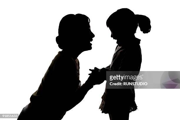 silluet - black and white holding hands stock pictures, royalty-free photos & images