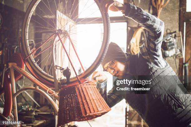 repairing the bike - b12 stock pictures, royalty-free photos & images