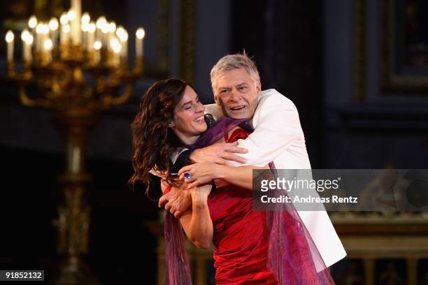 Katarina Witt and actor Ruediger Joswig perform on stage during the 'Jedermann' dress rehearsal at the Berlin Cathedral Church on October 13, 2009 in...