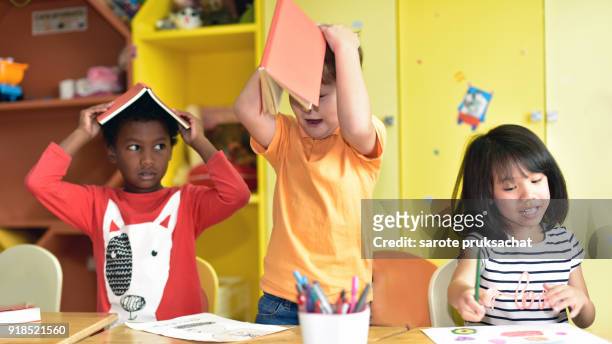 child having fun on learning  in an international school .teacher ,education, kid and primary school concept . - portrait of school children and female teacher in field stock pictures, royalty-free photos & images