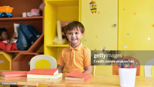 child  having fun learning  equipment  in an international school .kindergarten, preschool, kids . - summer school imagens e fotografias de stock