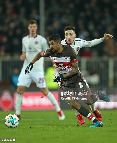 Jeremy Dudziak of St. Pauli and Kevin Moehwald of Nuernberg battle for the ball during the Second Bundesliga match between FC St. Pauli and 1. FC...