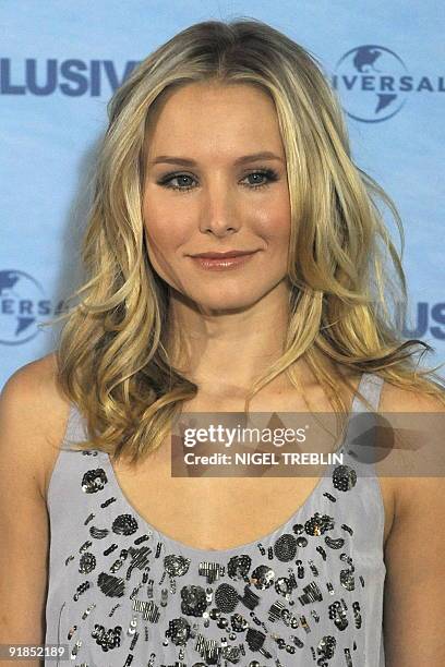 Actress Kristen Bell poses for photographers on the red carpet for the film "Couples Retreat" in the northern German city of Hamburg on October 13,...