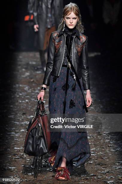 Model walks the runway at the Coach 1941 Ready to Wear Fall/Winter 2018-2019 Fashion show during New York Fashion Week on February 13, 2018 in New...