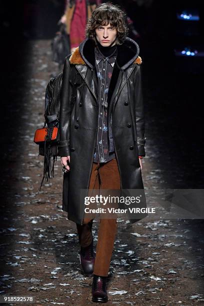 Model walks the runway at the Coach 1941 Ready to Wear Fall/Winter 2018-2019 Fashion show during New York Fashion Week on February 13, 2018 in New...