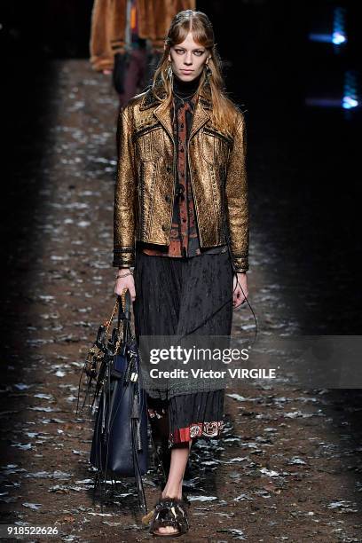 Model walks the runway at the Coach 1941 Ready to Wear Fall/Winter 2018-2019 Fashion show during New York Fashion Week on February 13, 2018 in New...