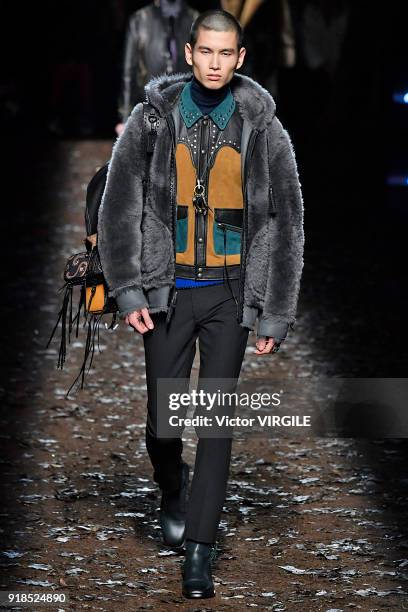 Model walks the runway at the Coach 1941 Ready to Wear Fall/Winter 2018-2019 Fashion show during New York Fashion Week on February 13, 2018 in New...