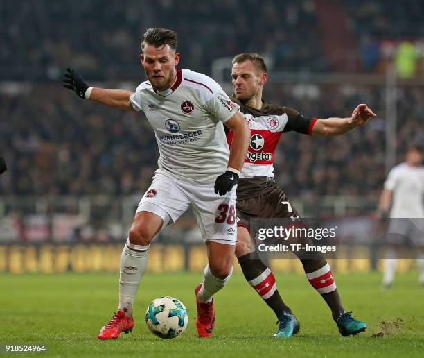 Eduard Loewen of Nuernberg and Bernd Nehrig of St. Pauli battle for the ball during the Second Bundesliga match between FC St. Pauli and 1. FC...