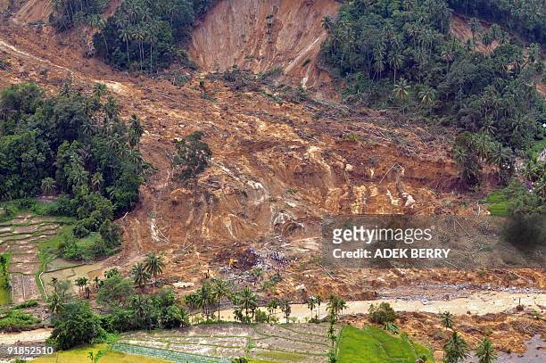 An aerial picture shows an area after landslides destroyed three villages following recent earthquakes in Pariaman on October 4, 2009. Rescuers held...