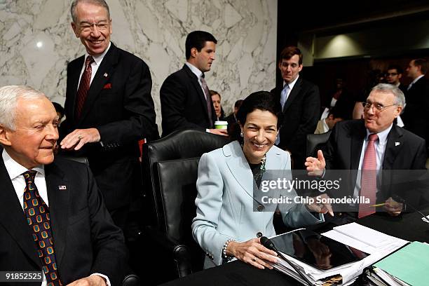 Republican Senate Finance Committee members Sen. Orrin Hatch , ranking member Sen. Charles Grassley and Sen. Jon Kyl joke that they must stand next...