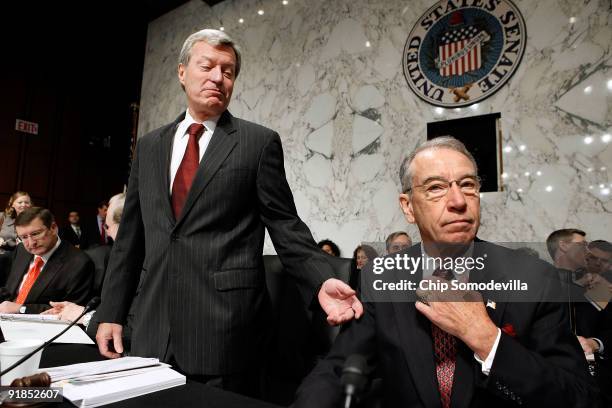 Senate Finance Committee Chairman Max Baucus talks with ranking member Sen. Charles Grassley before the committee is set to vote on health care...