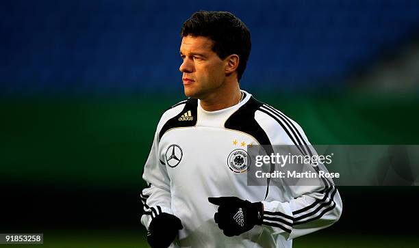 Michael Ballack warms up during the German National Team training session at the Hamburg Arena on October 13, 2009 in Hamburg, Germany.