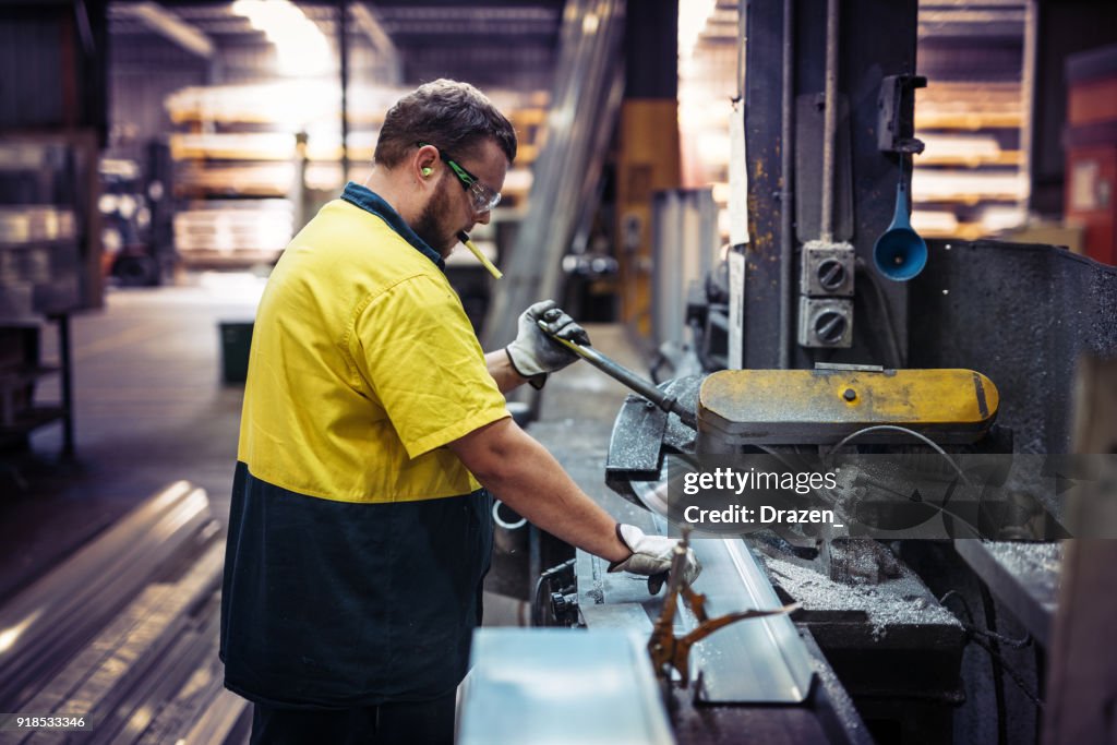 Work Hard Factory Hard Work In Factory Worker Cutting Metal Parts High-Res Stock Photo ...