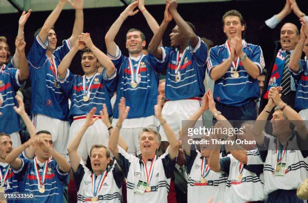 Soccer - 1998 World Cup - Final - France Vs Brazil - French coach Aimé Jacquet and French soccer team celebrate their victory in the final against...