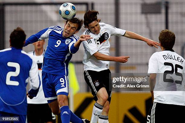 Bebras Natcho of Israel jumps for a header with Sebastian Rudy of Germany during the U21 international friendly match between Germany and Israel at...