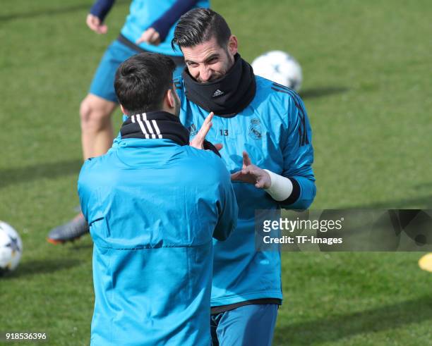 Kiko Casilla and Marco Asensio of Real Madrid looks on during a training session at Valdebebas training ground ahead their Round of 16 first leg UEFA...