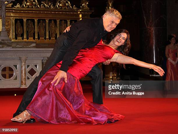 Katarina Witt and actor Ruediger Joswig perform on stage during the 'Jedermann' dress rehearsal at the Berlin Cathedral Church on October 13, 2009 in...