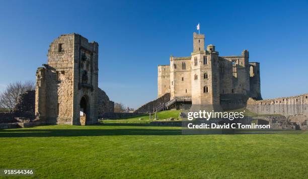 view across lawns to the great tower of warkworth castle, warkworth, northumberland, england, uk - warkworth castle stock pictures, royalty-free photos & images