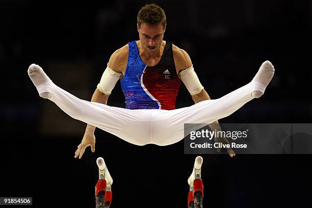 Benoit Caranobe of France competes in the parallel bars during the Artistic Gymnastics World Championships 2009 at O2 Arena on October 13, 2009 in...