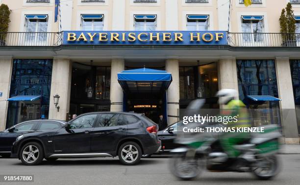 Police officer rides his motorcycle past the hotel Bayerischer Hof, the location for the upcoming 54th Munich Security Conference , in Munich,...