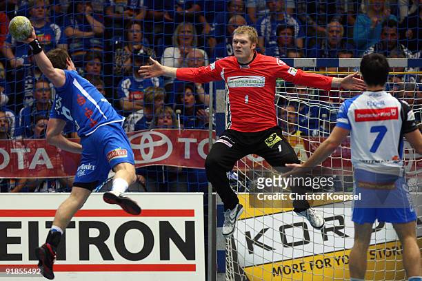Martin Strobel of Lemgo scores a goal against Johannes Bitter of Hamburg during the Handball Bundesliga match between TBV Lemgo and THW Kiel at the...