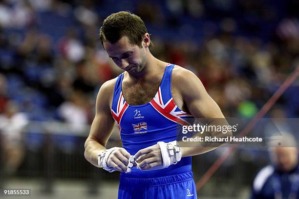 Yevgen Gryshchenko of Great Britain reacts after he competes on the horizontal bar during the Artistic Gymnastics World Championships 2009 at O2...