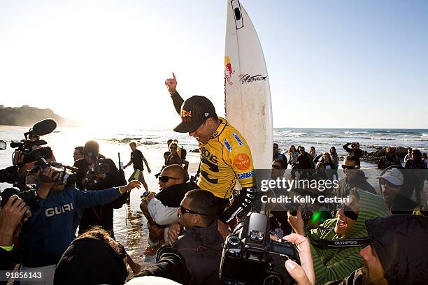 Adriano de Souza of Brazil is chaired up the beach upon the shoulders of friends and peers moments after winning the final of the Billabong Pro on...