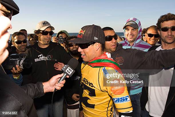 Adriano de Souza of Brazil is interviewed on the beach after winning the final of the Billabong Pro on October 13, 2009 at Sopelana, Spain. De Souza...