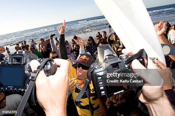 Adriano de Souza of Brazil celebrates victory after winning the final of the Billabong Pro on October 13, 2009 at Sopelana, Spain. De Souza defeated...
