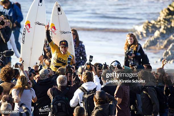 Adriano De Souza of Brazil claims his victory amidst a sea of media after winning the Billabong Pro Mundaka in the Basque Region on October 13, 2009...