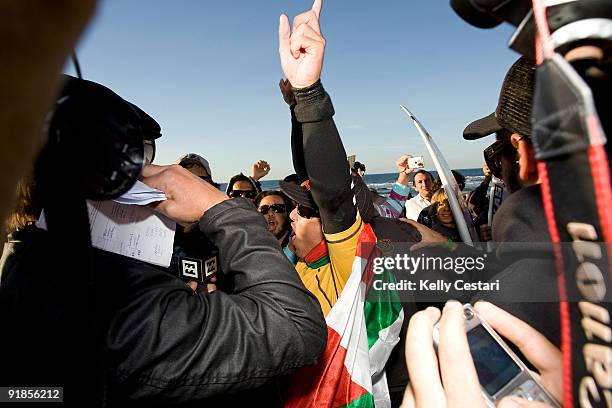 Adriano de Souza of Brazil celebrates victory after winning the final of the Billabong Pro on October 13, 2009 at Sopelana, Spain. De Souza defeated...