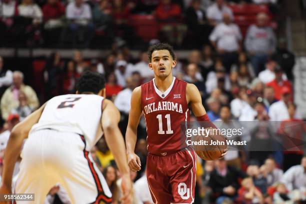 Trae Young of the Oklahoma Sooners brings the ball up court against Zhaire Smith of the Texas Tech Red Raiders during the game on February 13, 2018...