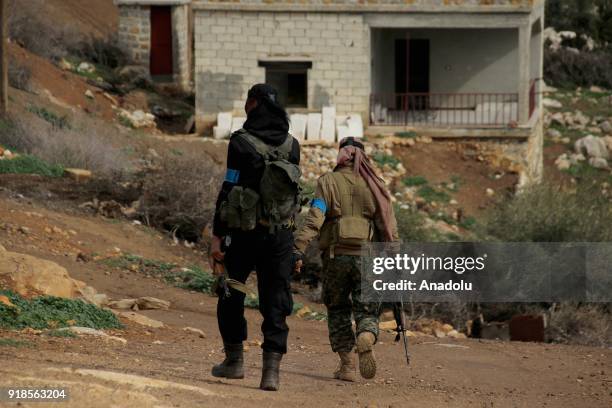 Members of Turkish military and Free Syrian Army search the Shadia village after liberating the villages of Karri, Sharbanli and Shadia, within the...