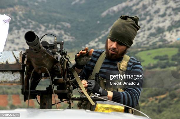 Soldier loads a gun while Turkish military and Free Syrian Army search the Shadia village after liberating the villages of Karri, Sharbanli along...