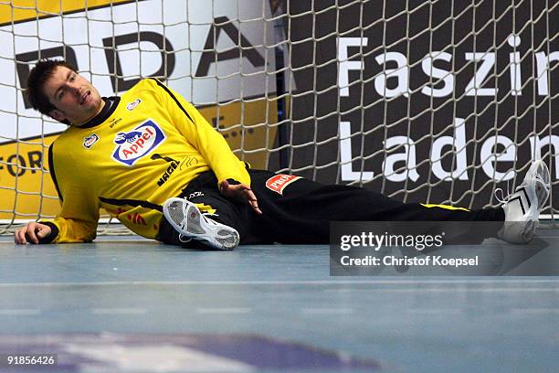 Carsten Lichtlein of Lemgo lies dejected on the pitch during the Handball Bundesliga match between TBV Lemgo and THW Kiel at the Lipperlandhalle on...