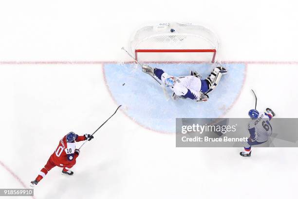 Matt Dalton of Korea makes a save against Roman Cervenka of the Czech Republic during the first period during the Men's Ice Hockey Preliminary Round...