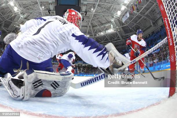 Matt Dalton of Korea makes a save against Roman Cervenka of the Czech Republic during the first period during the Men's Ice Hockey Preliminary Round...