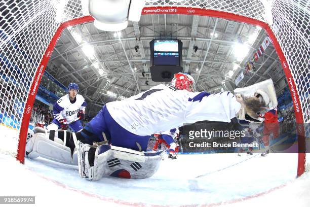 Matt Dalton of Korea makes a save against Roman Cervenka of the Czech Republic during the first period during the Men's Ice Hockey Preliminary Round...
